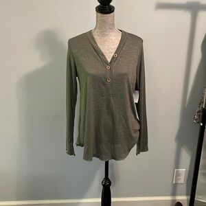 P.S. Love size medium long sleeve shirt with three wooden buttons in front.